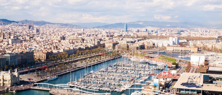 aerial view of barcelona city with port vell 768x330